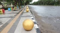 bollard ball barrier between road and sidewalk part of street furniture