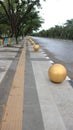 bollard ball barrier between road and sidewalk part of street furniture