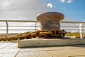 A bollard and chain used for tying up boats when docking Royalty Free Stock Photo