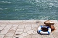 Bollard and lifebuoy, lifebelt on a pier by the sea Royalty Free Stock Photo