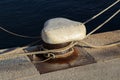 Bollard with a mooring line wrapped around it Royalty Free Stock Photo