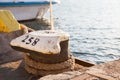 Bollard with mooring on the quay Royalty Free Stock Photo