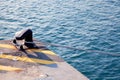 Bollard in port with rope looped around Royalty Free Stock Photo