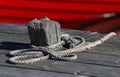 Bollard and red fishing boat Royalty Free Stock Photo