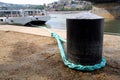 Bollard with rope in a harbor
