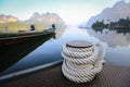 Bollard on sea water, rope for mooring a vessel is adhered to a pier Royalty Free Stock Photo
