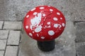Bollard in the Wijnhaven harbor in Rotterdam painted as fly agaric mushroom Royalty Free Stock Photo