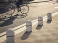 Bollards on walkway city People cycling on street urban lifestyle