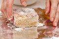 BOLO GELADO is a traditional Brazilian cake - Wrapping the cake with coconut sprinkles in aluminum foil. Close-up Royalty Free Stock Photo