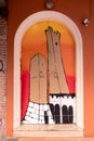 Bologna, design of two towers painted on an old door