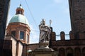 he statue of St. Petronius (Statua di San Petronio) in Bologna, Italy between Two Towers