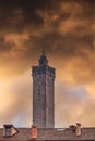 Bologna, Italy Asinelli Tower, part of Due Torri, medieval Two Towers city symbol, against dramatic orange clouds