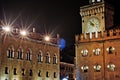 Bologna, Italy. The clock tower Piazza Maggiore at night