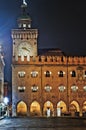 Bologna, Italy. The clock tower Piazza Maggiore at night