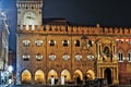 Bologna, Italy. The clock tower Piazza Maggiore at night