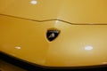 Bologna, Italy - December 3, 2019: Lamborghini logo on a yellow hood.  Luxury stylish sport car. Royalty Free Stock Photo