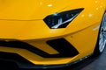 Bologna, Italy - December 9, 2019: Original yellow Lamborghini Aventador. Logo and front grill, headlights. Luxury stylish sport c Royalty Free Stock Photo