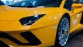 Bologna, Italy - December 9, 2019: Original yellow Lamborghini Aventador. Logo and front grill, headlights. Luxury stylish sport c Royalty Free Stock Photo