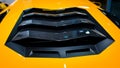 Bologna, Italy - December 9, 2019: Original yellow Lamborghini Aventador. Logo and front grill, headlights. Luxury stylish sport c Royalty Free Stock Photo