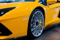 Bologna, Italy - December 9, 2019: Original yellow Lamborghini Aventador. Logo and front grill, headlights. Luxury stylish sport c