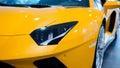 Bologna, Italy - December 9, 2019: Original yellow Lamborghini Aventador. Logo and front grill, headlights. Luxury stylish sport c Royalty Free Stock Photo