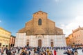 Bologna, Italy, March 17, 2019: Basilica di San Petronio church building facade and many walking people Royalty Free Stock Photo