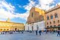 Bologna, Italy, March 17, 2018: Basilica di San Petronio church and Palazzo dei Banchi palace building Royalty Free Stock Photo