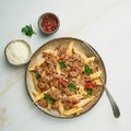 Bolognese pasta. Fusilli with tomato sauce, ground minced beef. Traditional italian cuisine. Marble table. Top view Royalty Free Stock Photo