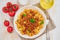 Bolognese pasta. Fusilli with tomato sauce, ground minced beef. Traditional italian cuisine. White wooden table. Top view Royalty Free Stock Photo