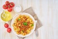 Bolognese pasta. Fusilli with tomato sauce, ground minced beef. Traditional italian cuisine. White wooden table. Top view, copy Royalty Free Stock Photo