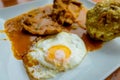 Bolon de verde with fried eggs and meat stew ecuadorian food galapagos