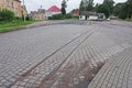 Fragment of a narrow-gauge railway track on a cobbled surface in