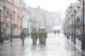 Bolshaya Pokrovskaya street in Nizhny Novgorod during a snowfall masks a military patrol