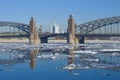 Bolsheokhtinsky bridge and the Smolny Cathedral in the spring landscape with an ice drift. Saint Petersburg, Russia Royalty Free Stock Photo