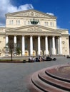 Bolshoi theater in Moscow. People rest on the benches on the square.