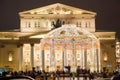 The Bolshoi Theatre on Teatralnaya Square during Christmas time, traffic on the street.