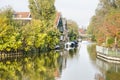 Houses, gardens, sloops and canal Royalty Free Stock Photo