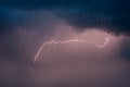 Bolt of dramatic and moody lightning marked in a dark stormy sky