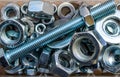 Bolt, hex nuts and washers, stacked assorted in plastic container close up macro Royalty Free Stock Photo