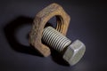 Bolt and nut on dark background Royalty Free Stock Photo