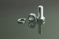 Bolt, nut and spring washer on reflective surface Royalty Free Stock Photo