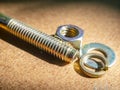 Bolt and nut on a wooden table Royalty Free Stock Photo