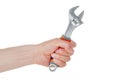 Bolt wrench, adjustable cap wrench in the hand of a worker, builder, isolated on a white Royalty Free Stock Photo