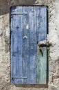 Bolted and locked rugged wooden door painted blue Royalty Free Stock Photo