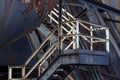 Bolted metal Bolted metal industrial stairway, peeled paint and rusted stairway, peeled paint and rusted metal, horizontal aspect