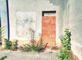 Bolted windows and a walled door on the facade of building Royalty Free Stock Photo