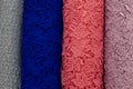 Bolts of lace fabric blue, pink, magenta and gray colors Royalty Free Stock Photo