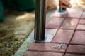 The bolts lie on red paving stones, ready for installation. Royalty Free Stock Photo