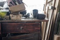 bolts and screws and all sorts of old junk on a dusty wooden table in the garage Royalty Free Stock Photo