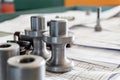 Bolts after turning with thread on the background of technical drawings Royalty Free Stock Photo